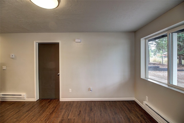 unfurnished room featuring a baseboard heating unit, a baseboard radiator, dark wood-style floors, and baseboards