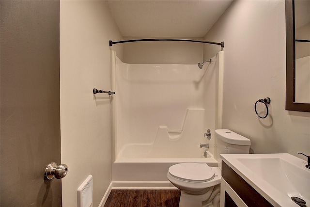 bathroom featuring toilet, wood finished floors, vanity, visible vents, and shower / bathing tub combination