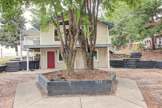 view of front of home with stairs