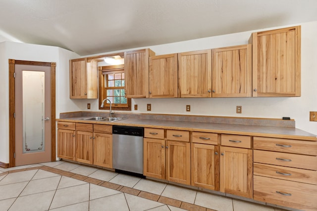 kitchen with sink, dishwasher, and light tile patterned floors