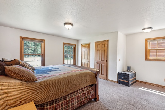 carpeted bedroom with a textured ceiling