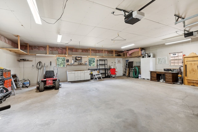 garage featuring a workshop area and a garage door opener