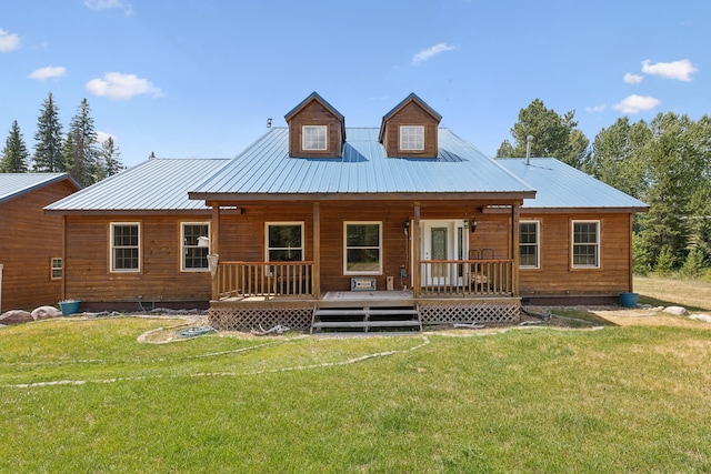 back of property featuring a lawn