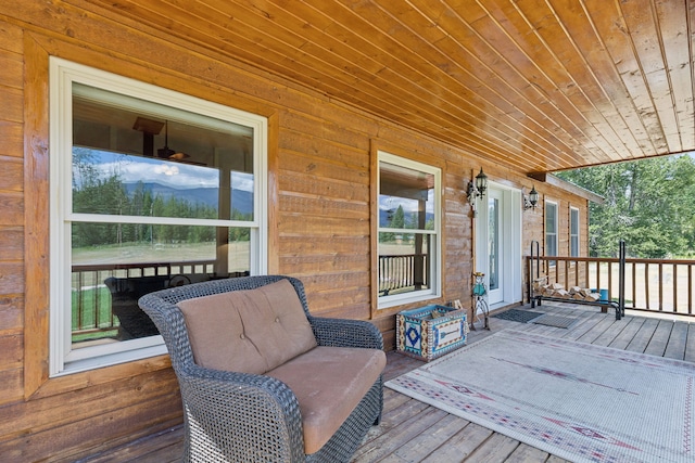 wooden terrace with a mountain view