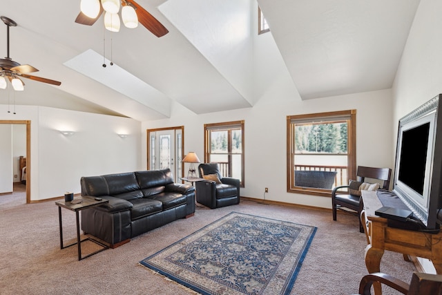 living room with light colored carpet, ceiling fan, and high vaulted ceiling