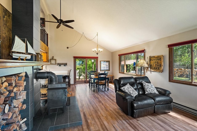 159 Sylvan Dr, Bigfork, MT 59911 - living room with ceiling fan, wood finished floors, plenty of natural light, and high vaulted ceiling