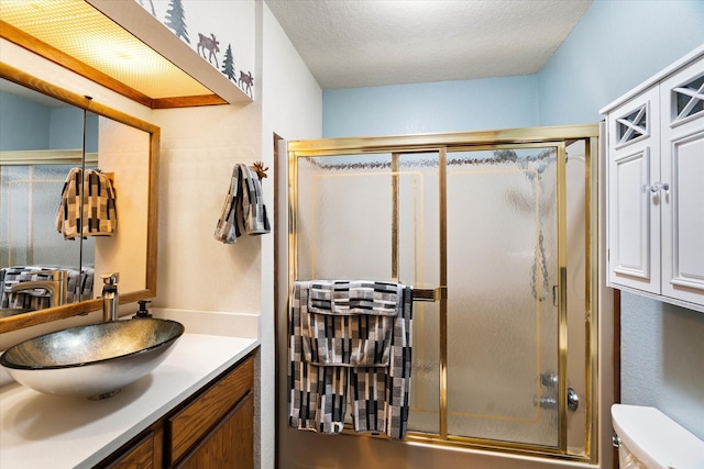 159 Sylvan Dr, Bigfork, MT 59911 - bathroom with vanity and a textured ceiling