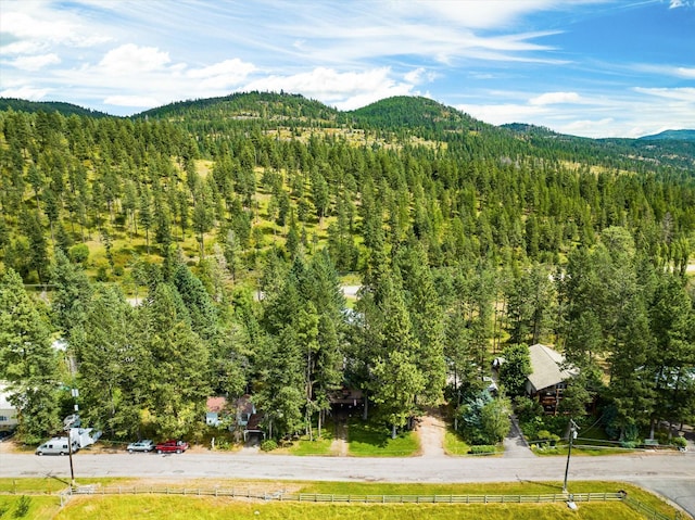159 Sylvan Dr, Bigfork, MT 59911 - view of mountain backdrop featuring a heavily wooded area