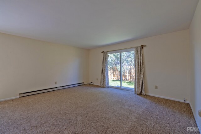 unfurnished room featuring light carpet and a baseboard radiator