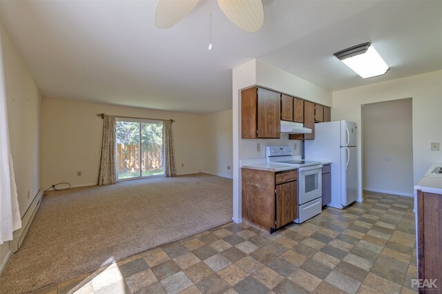 kitchen with white appliances, a baseboard radiator, and carpet