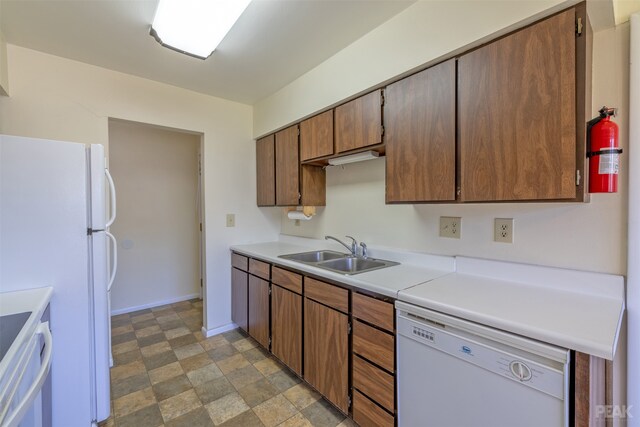 kitchen with sink and white appliances