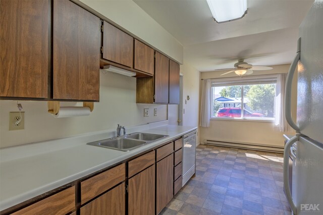 kitchen with sink, ceiling fan, baseboard heating, white refrigerator, and stainless steel dishwasher