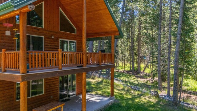 rear view of house featuring a deck