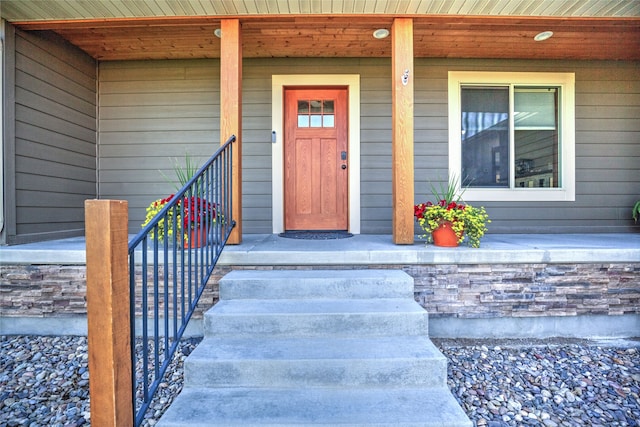 doorway to property featuring covered porch