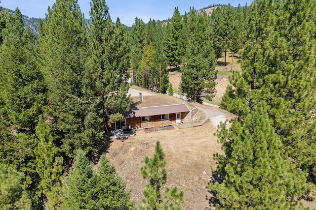 drone / aerial view featuring a view of trees