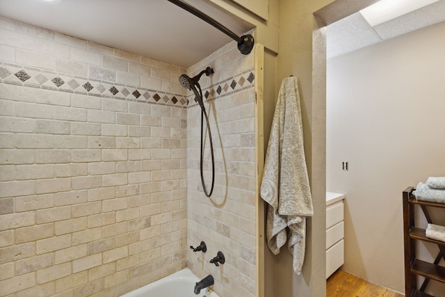 full bath with shower / bathing tub combination and wood finished floors