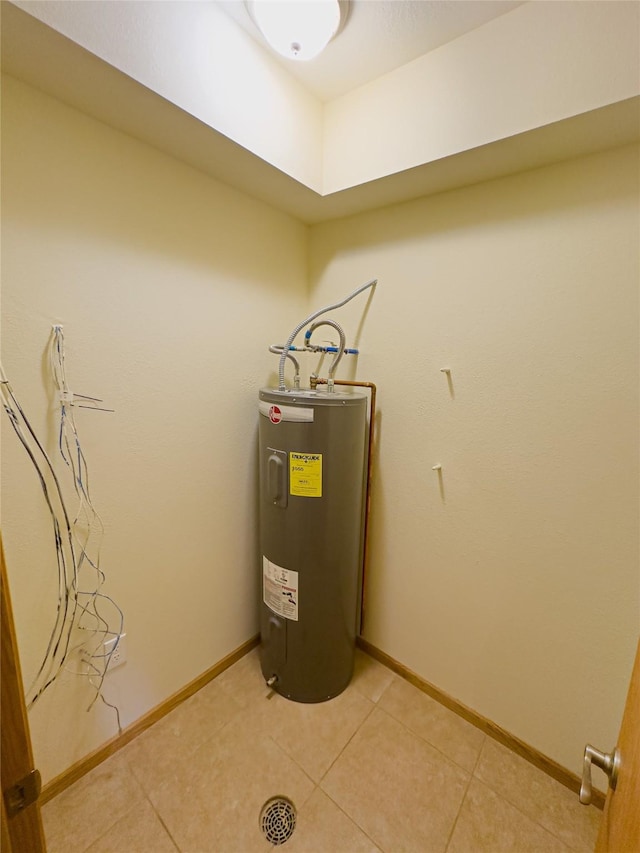 utility room featuring water heater