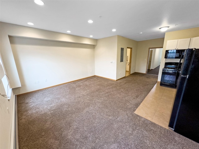 kitchen featuring light colored carpet, black appliances, and white cabinets