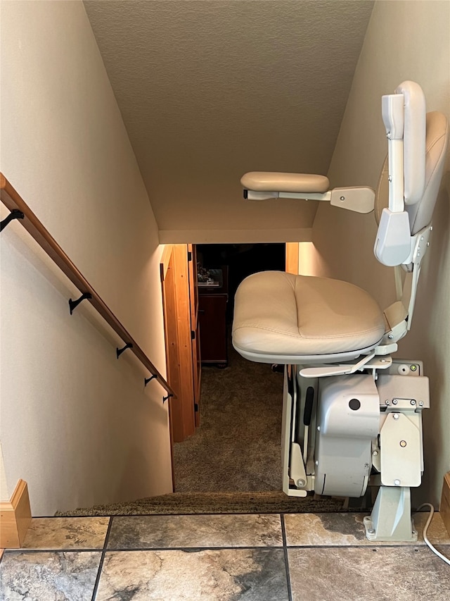 bathroom featuring tile patterned floors and a textured ceiling