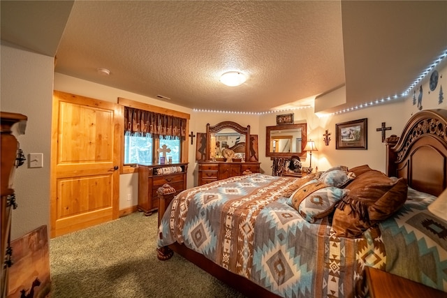 carpeted bedroom with a textured ceiling