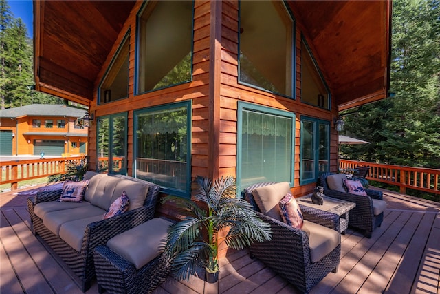 wooden terrace featuring an outdoor hangout area