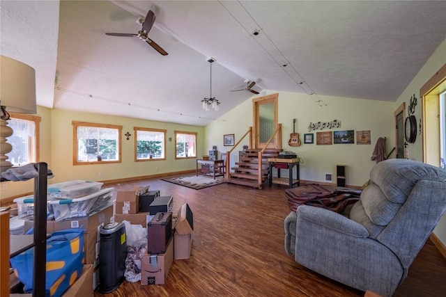 living room featuring ceiling fan, a textured ceiling, lofted ceiling, and wood-type flooring