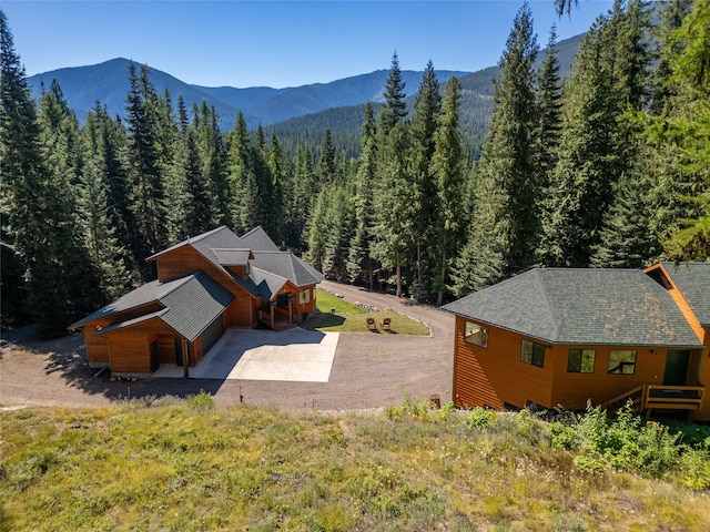 birds eye view of property with a mountain view