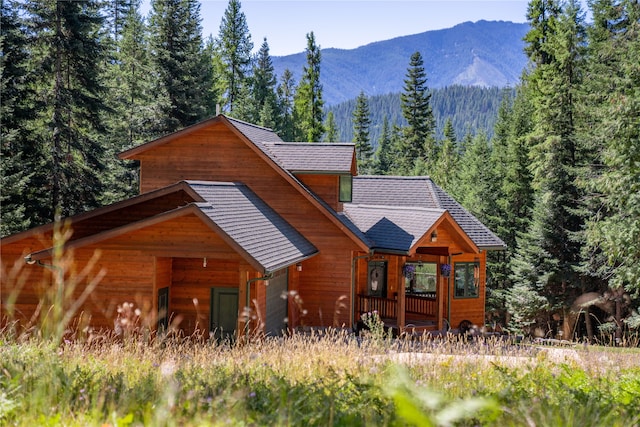 log cabin with a mountain view