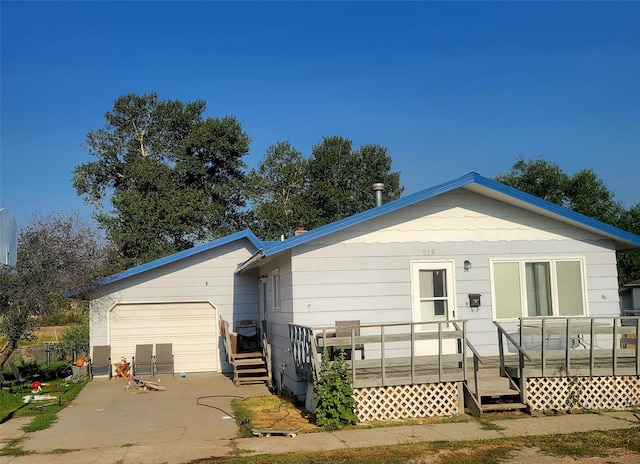 back of house with a deck