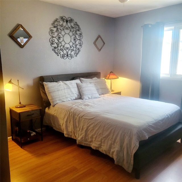 bedroom with hardwood / wood-style floors