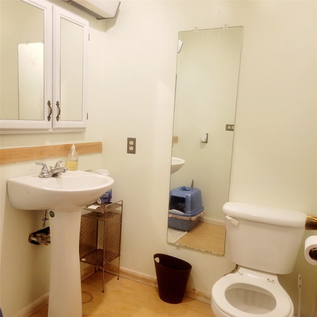 bathroom with sink and toilet