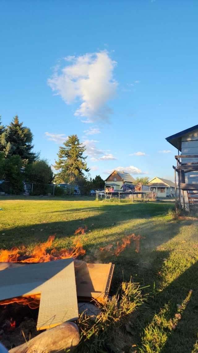 view of yard with a fire pit