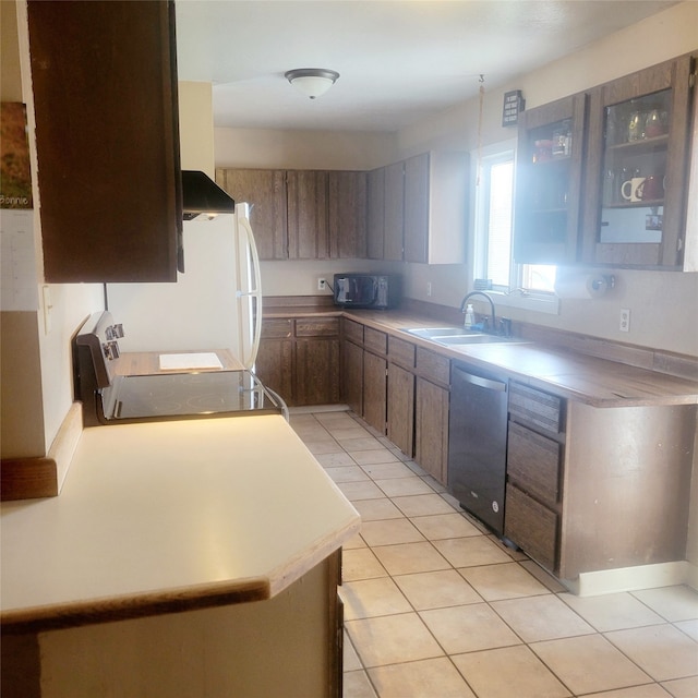 kitchen with stainless steel dishwasher, light tile patterned flooring, wall chimney range hood, sink, and stove