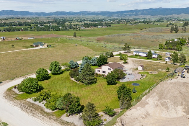 drone / aerial view featuring a mountain view and a rural view