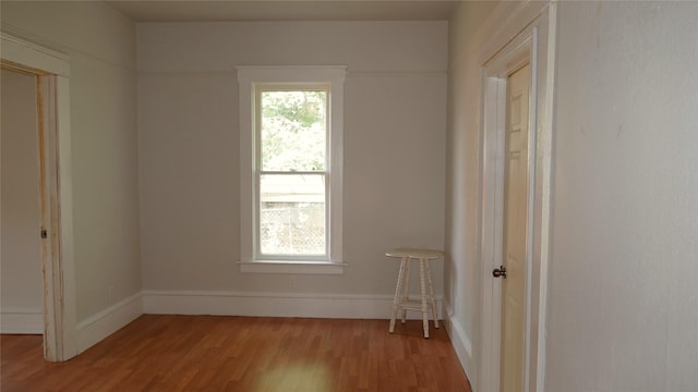 unfurnished room with light hardwood / wood-style floors