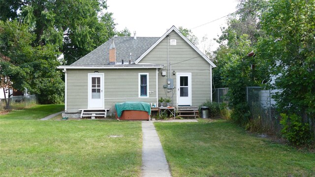 721 5th Ave S, Great Falls, MT 59405 - back of property with entry steps and roof with shingles