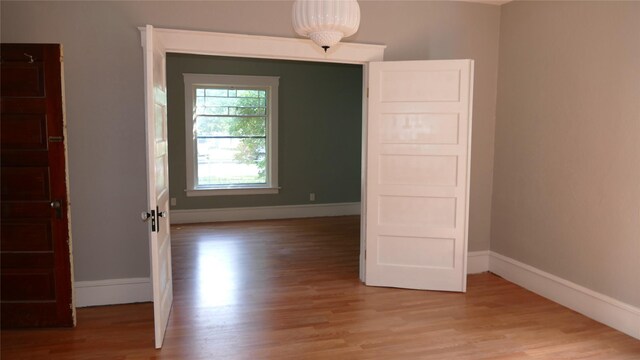 721 5th Ave S, Great Falls, MT 59405 - unfurnished room featuring light wood-type flooring and baseboards