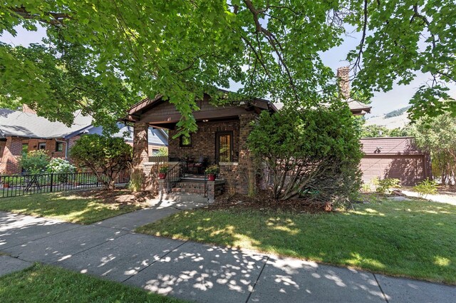 view of front facade with a garage and a front yard