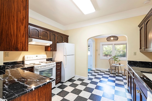 kitchen with ornamental molding, dark brown cabinets, and white appliances