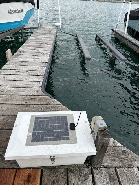 dock area featuring a water view