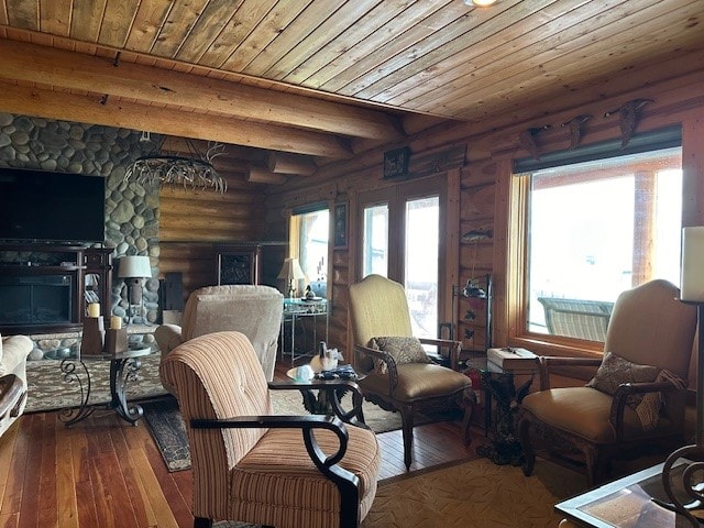 sitting room featuring beam ceiling, hardwood / wood-style flooring, wooden ceiling, and a fireplace