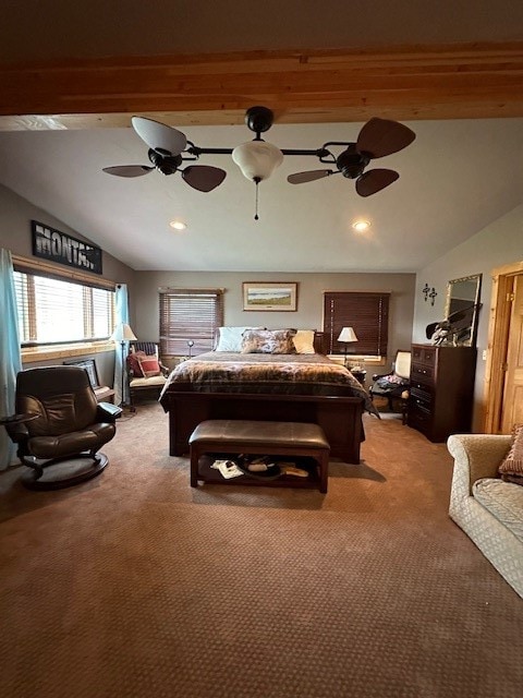 carpeted bedroom with lofted ceiling with beams and ceiling fan