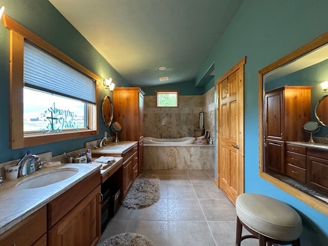 bathroom with vanity, shower with separate bathtub, lofted ceiling, and tile patterned floors