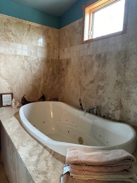 bathroom with tiled tub