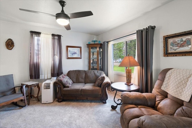 carpeted living room featuring ceiling fan