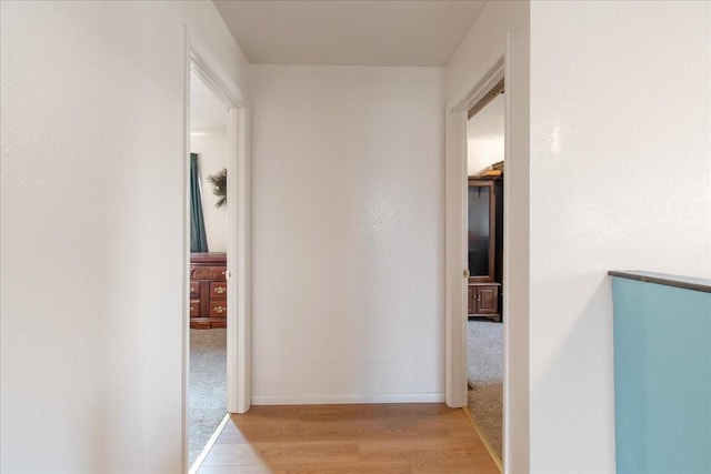 hallway with light wood-type flooring