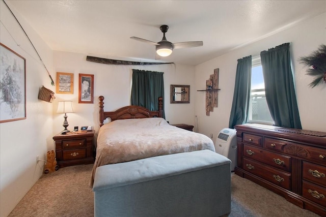 bedroom featuring light carpet and ceiling fan