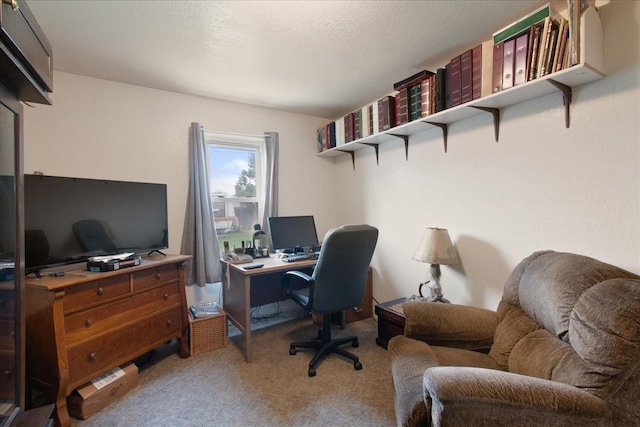 carpeted home office with a textured ceiling