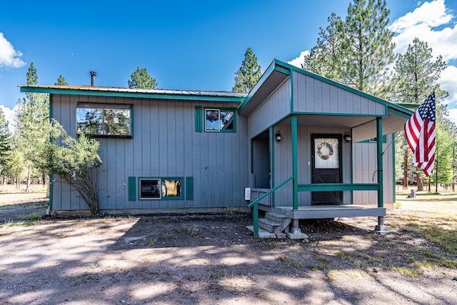 view of front of house featuring metal roof