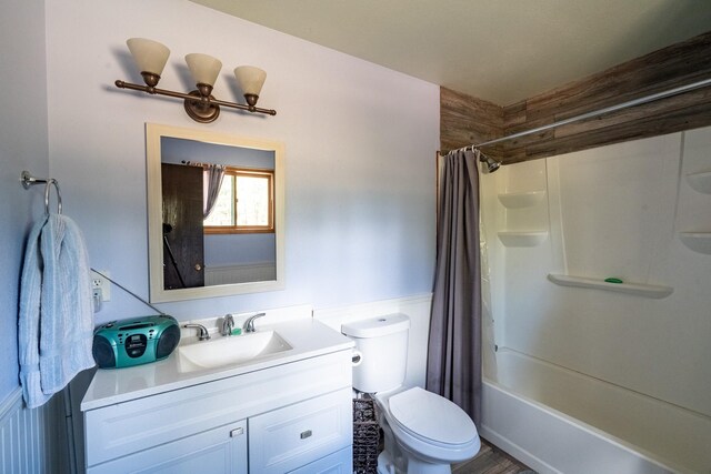 full bath with vanity, shower / bath combination with curtain, and toilet